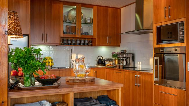 Huon River Hideaway’s beautifully appointed, well-equipped kitchen which features custom-built timber cupboards and most importantly a coffee machine. Picture: Jon Jarvela Photographs