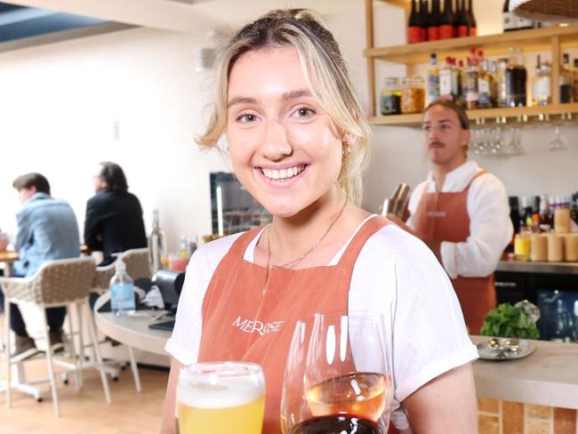 Ivy Thomas Waitress and Tom Higgins (behind)Waiter, are both wait temp staff there are Labour shortages due to covid, in Melrose Bulimba, on Sunday 3rd July 2022 - Photo Steve Pohlner