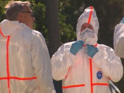 Authorities and investigators in Mariposa Rd, Bilgola Plateau, after asbestos fibres were spread across a number of homes allegedly by cleaning contractors using high-pressure hoses on a roof. Picture: Channel 9 News