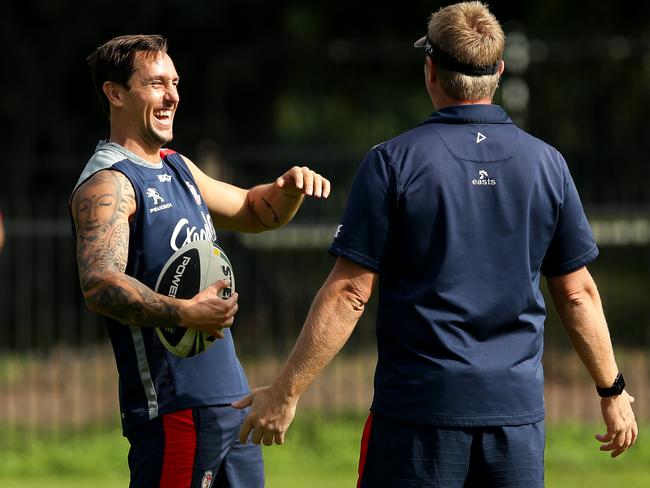 Mitchell Pearce all smiles as he talks to coach Trent Robinson. Picture : Gregg Porteous