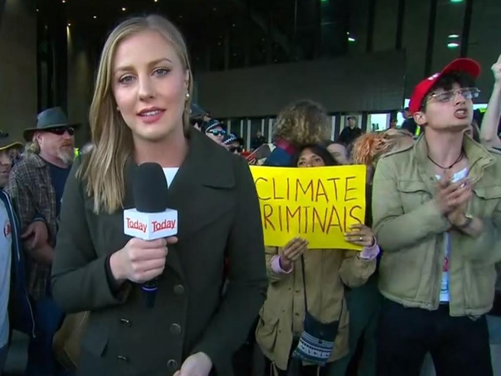 Today reporter Izabella Staskowski in front of the protest. Picture: Nine