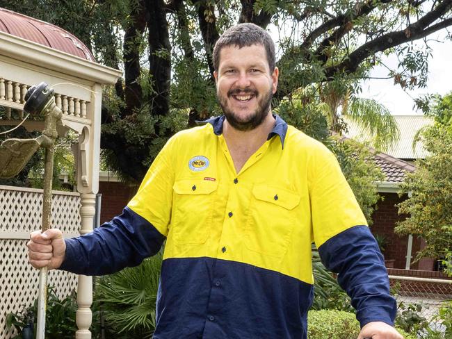 8,April, 2024: Woodville-West Torrens footballer Jarrad Redden doing his lawn mowing rounds which has helped him drop 15kg. Picture: Kelly Barnes