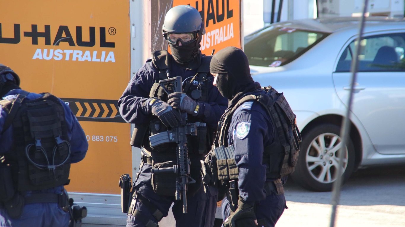 Heavily armed tactical police were involved in this morning's police operation at Sapphire Beach. Picture: Frank Redward