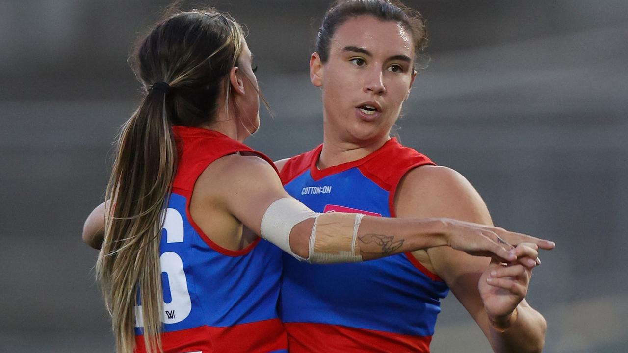 Elizabeth Snell (left) and Bonnie Toogood celebrate a goal. Picture: AFL Photos via Getty Images