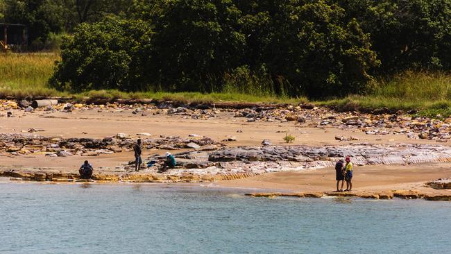 The croc also eyed off some land-based anglers near the boat ramp. Picture: Michael Franchi