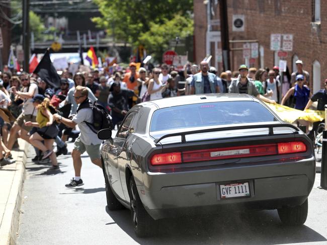 A vehicle drives into a group of protesters demonstrating against a white nationalist rally in Charlottesville. Picture: The Daily Progress via AP