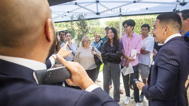 Auctioneer Edward Pena takes bids at a Castle Hill townhouse auction. Picture: Jeremy Piper