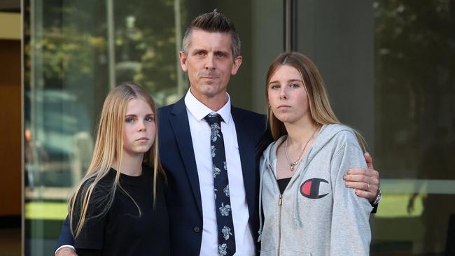 Lee Lovell embraces his daughters Kassie and Scarlett after sentencing at the Supreme Court of Qld. Picture: Liam Kidston