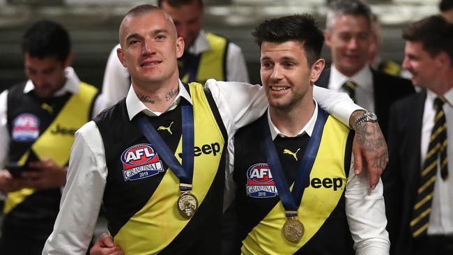 Dustin Martin and Trent Cotchin enjoy the spoils of another Richmond premiership. Picture: Michael Klein.