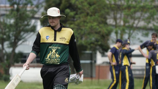 Bayswater’s Jack Pollard walks as Balwyn players celebrate his wicket. Picture: Valeriu Campan