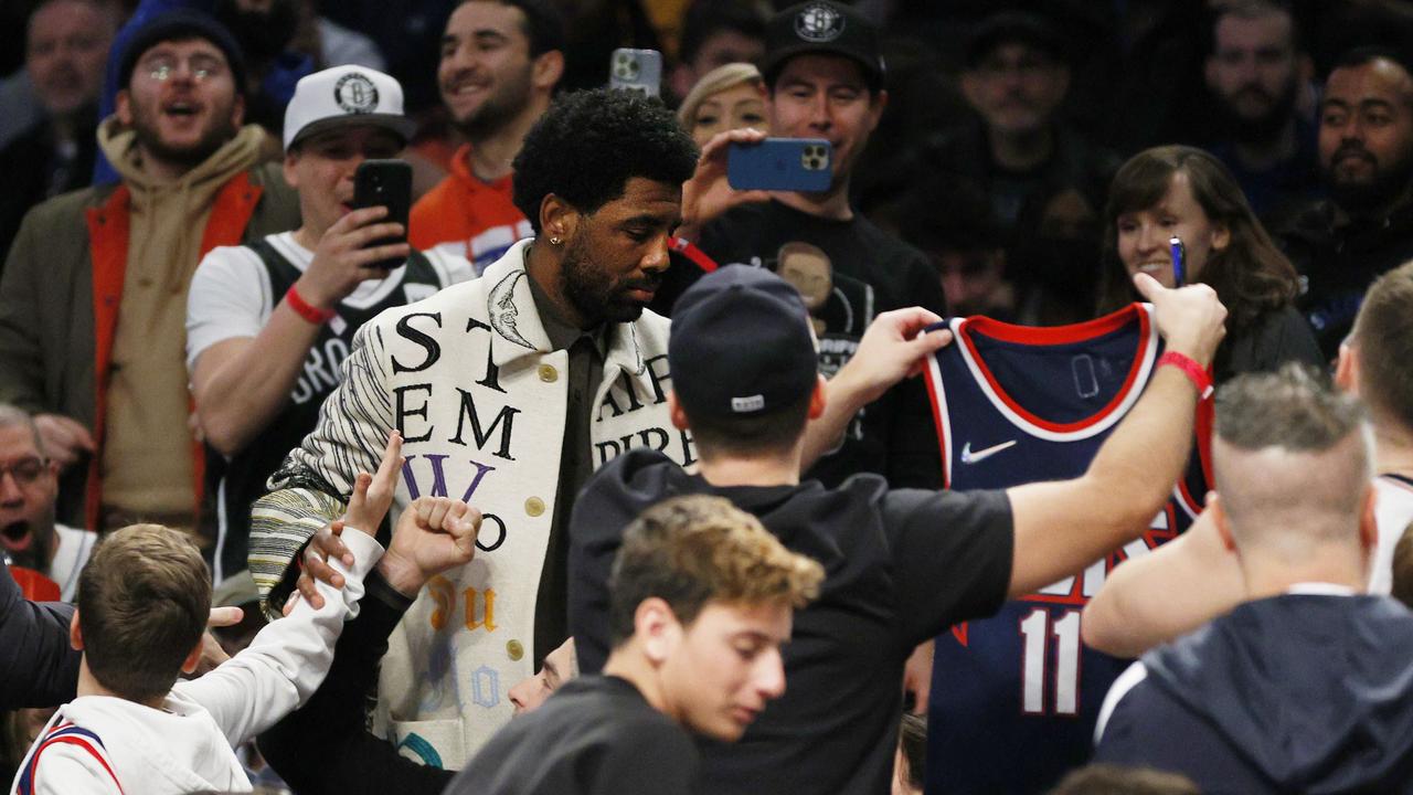 Kyrie Irving signs BURNT jersey for Brooklyn Nets fan after his house  catches fire