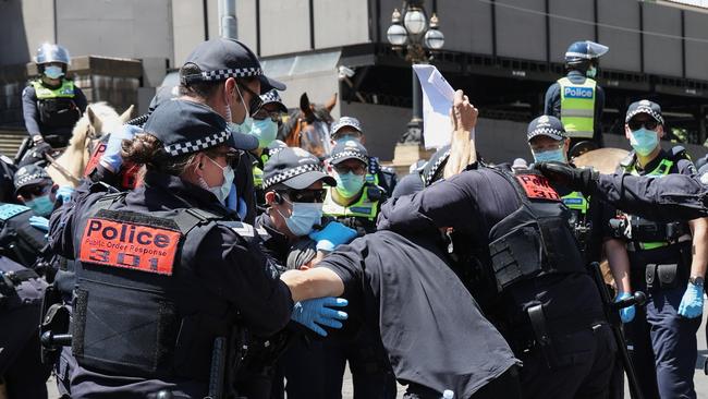 Police clashed with anti-lockdown protesters outside Parliament House in Spring Street in the first week of Melbourne’s freedom from lockdown. Picture: NCA NewsWire / Ian Currie