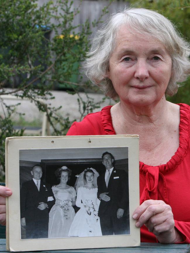 Elaine Postlethwaite, 72, with a photo of herself with husband Len on their wedding day. He had refused to leave and died trying to save their home. 