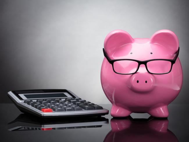 Close-up Of Pink Piggy Bank And Calculator On Grey Background; superannuation saving generic