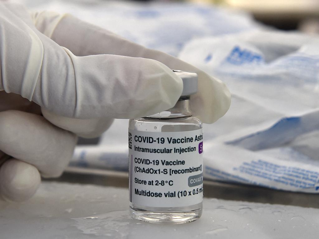 A health worker prepares to hold a vial of the AstraZeneca Covid-19 coronavirus vaccine. Picture: Yad Kramdi/AFP