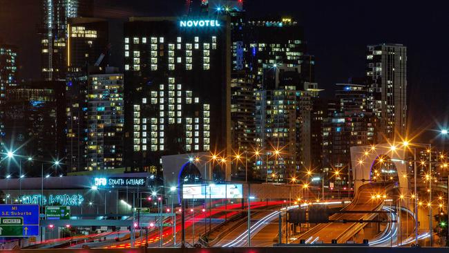 The Novotel South Wharf lights its windows in a message to Melbourne to ‘Stay home’ as Stage 4 lockdowns and a nightly curfew remain in place. Picture: Mark Stewart