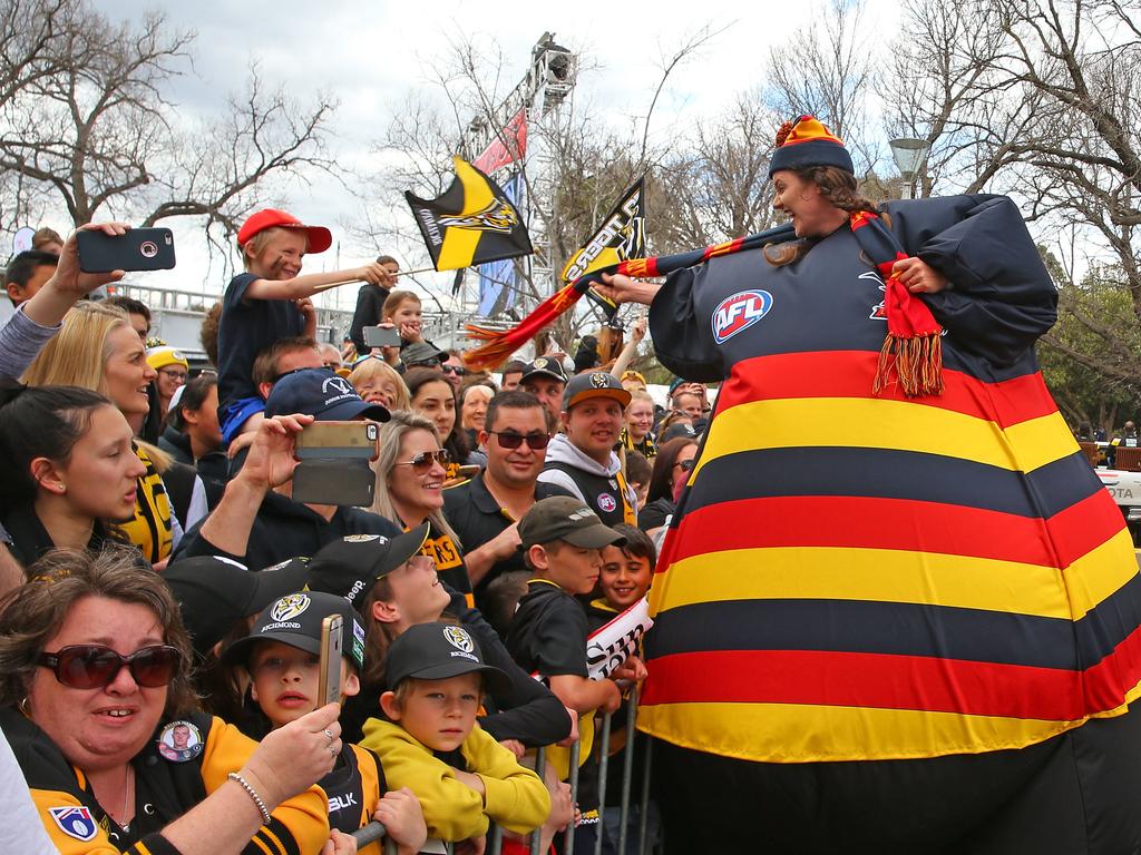 Tigers and Crows fans in the crowd show their support during the 2017 AFL Grand Final Parade on Friday. Picture: Scott Barbour/Getty Images