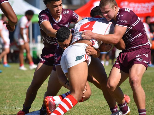 Ratu Cayuqueo is hit by Manly defence in the Harold Matthews Cup. Picture: Sean Teuma/NewsLocal