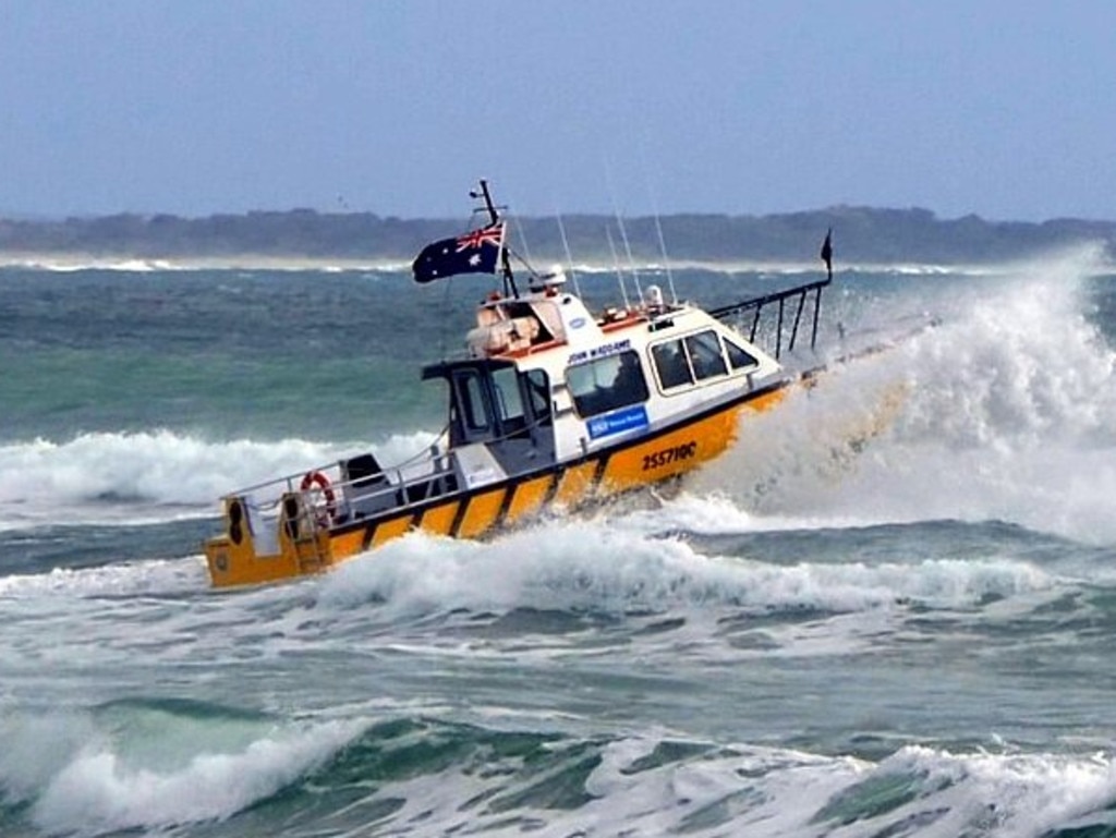 Noosa Coast Guard vessel John Waddams crossing the bar after a week of strong winds and big swells.