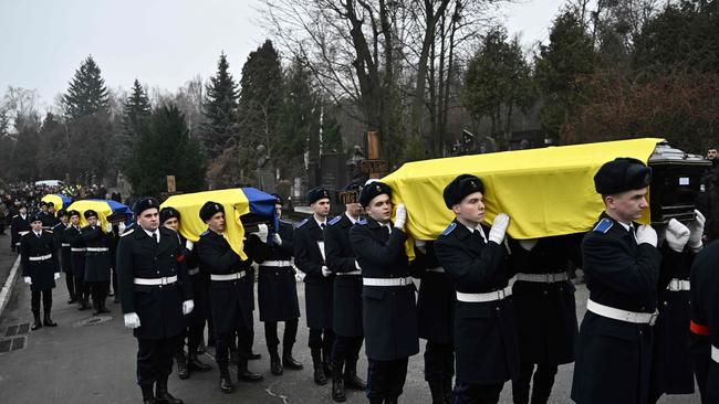 Ukrainian servicemen act as pall bearers during the funeral of Interior Minister Denys Monastyrsky and his aides on Saturday. Picture: AFP