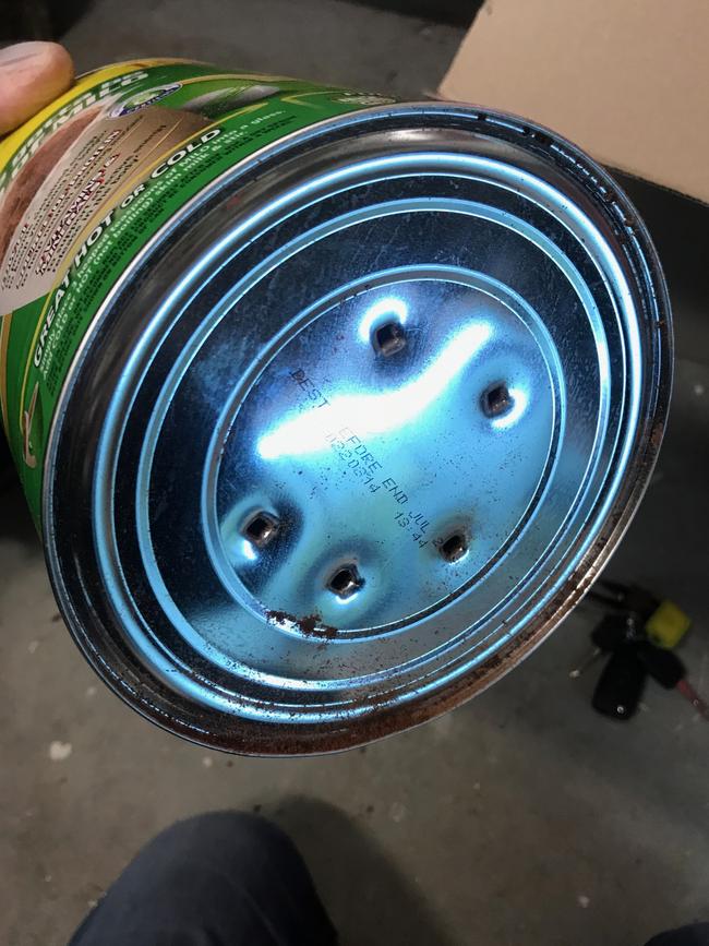 Holes punctured in lid of Milo Tin. Picture: Supplied