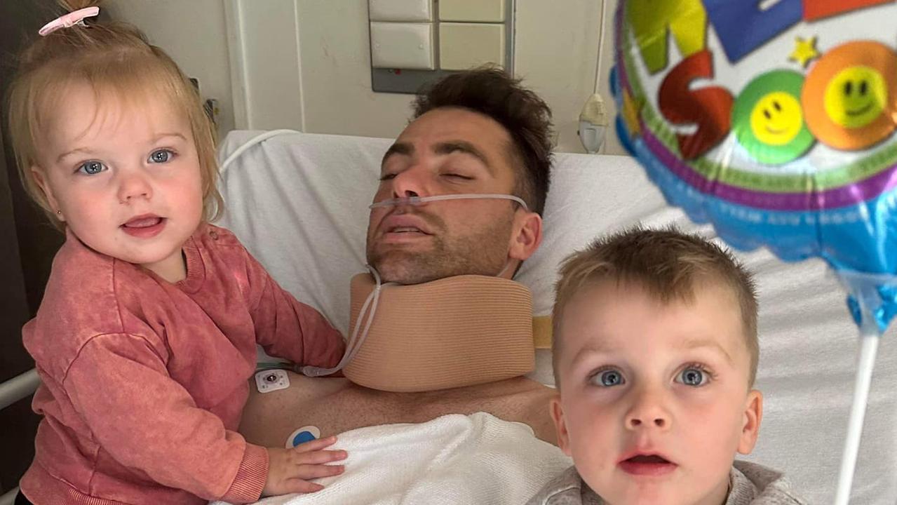 Corio footballer Joel Bennett with his two children at the Albert Hospital. Picture: Joel Bennett Facebook.