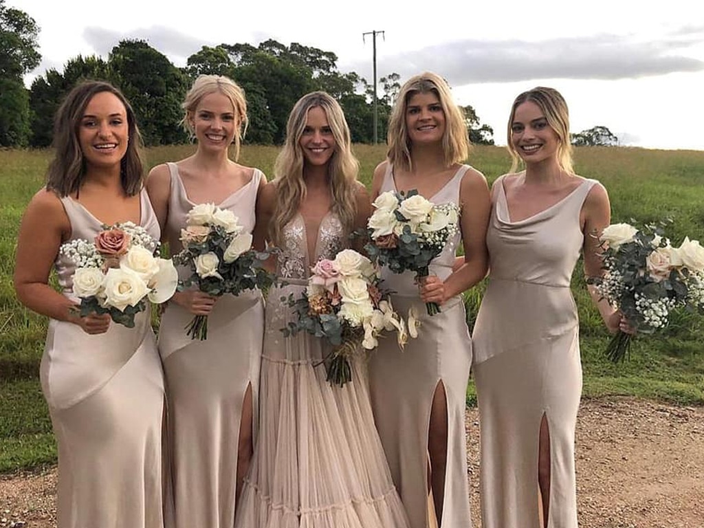 Margot Robbie serves as a bridesmaid at a friend s wedding in