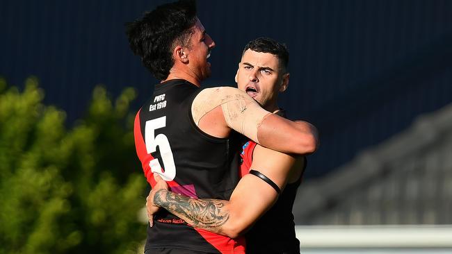 Paul Ahern of Pascoe Vale is congratulated by team mates after kicking a goal during the round two Strathmore Community Bank Premier Division Seniors match between Pascoe Vale and Strathmore at Raeburn Reserve, on April 20, 2024, in Melbourne, Australia. (Photo by Josh Chadwick)