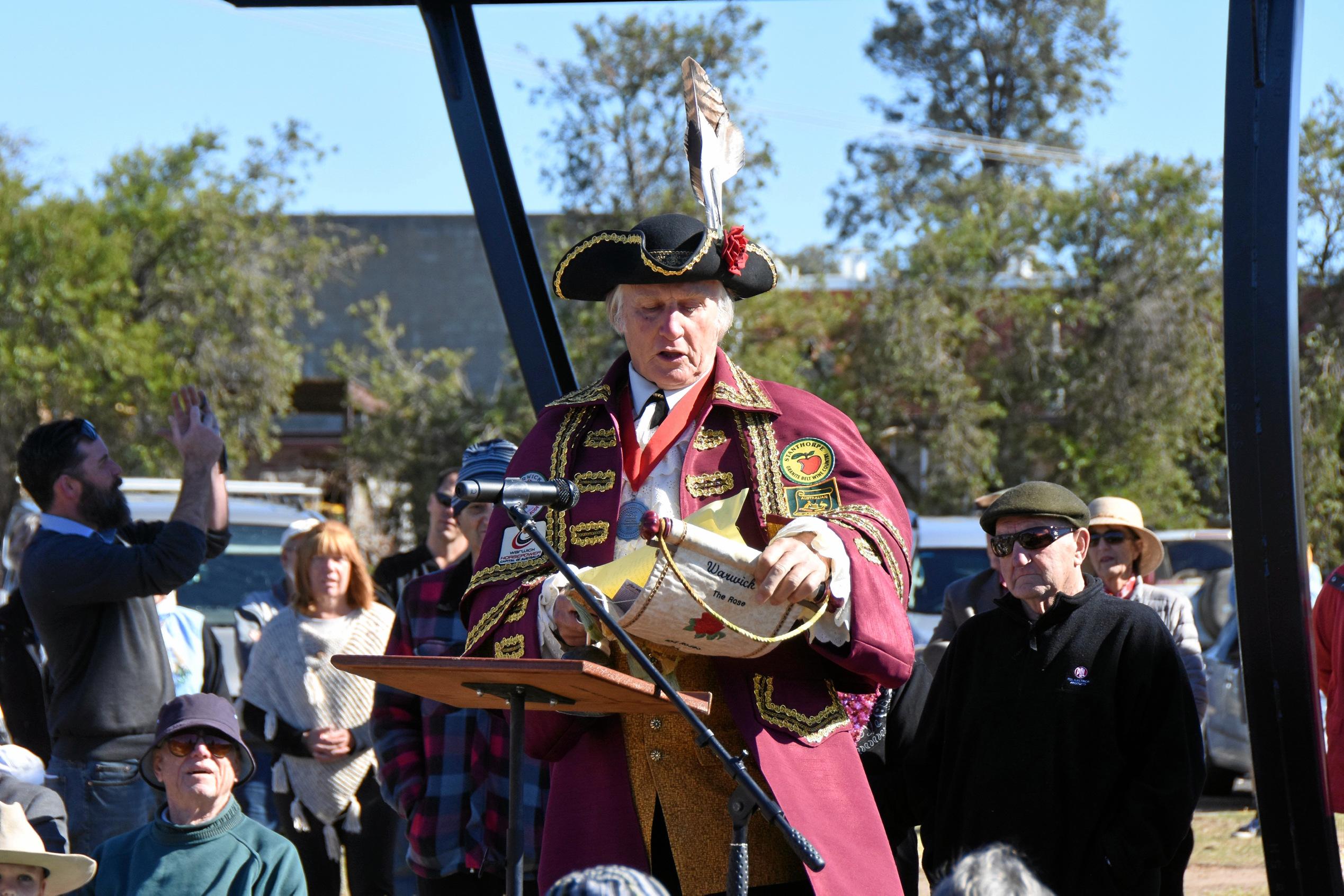 Warwick Town Crier Bob Townshend reads his speech for John Simpson. Picture: Chris Lines