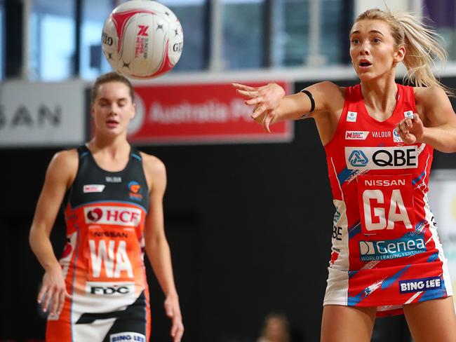 BRISBANE, AUSTRALIA - AUGUST 02: Helen Housby of the Swifts passes the ball during the round one Super Netball match between the Giants and the NSW Swifts at Nissan Arena on August 02, 2020 in Brisbane, Australia. (Photo by Jono Searle/Getty Images)