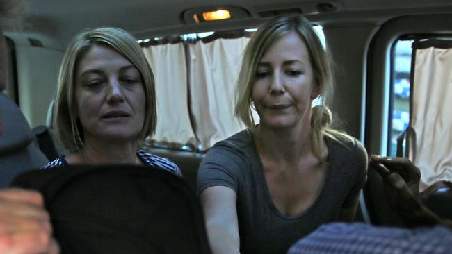 Australian TV journalist Tara Brown, left, and Sally Faulkner, right, sit in a minivan after they are released from a Lebanese jail. Picture: AP