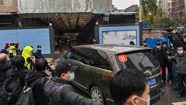 Members of the World Health Organisation (WHO) team, investigating the origins of the COVID-19 coronavirus, arrive at the closed Huanan Seafood wholesale market in Wuhan, China's central Hubei province on January 31, 2021. Picture: AFP