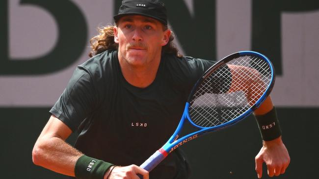 PARIS, FRANCE - MAY 27: Max Purcell of Australia runs for a shot against Henri Squire of Germany in the Men's Singles first round match on Day Two of the 2024 French Open at Roland Garros on May 27, 2024 in Paris, France. (Photo by Clive Mason/Getty Images)