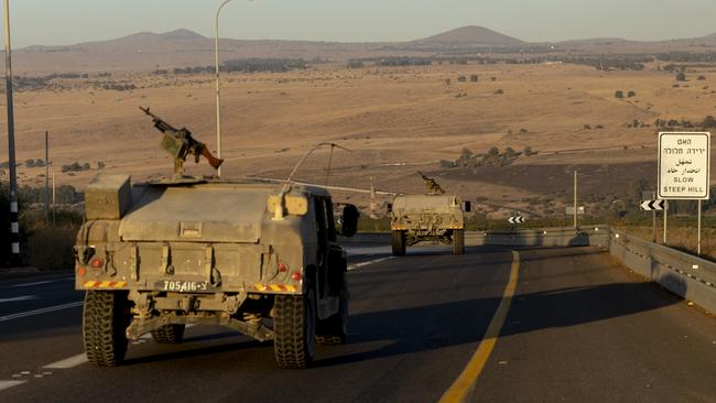 Israeli army vehicles move through northern Israel as Hezbollah's missiles land in the area. Picture: Getty