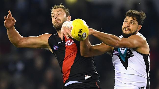 Tom Bellchambers of the Bombers and Patrick Ryder of the Power compete in the ruck.