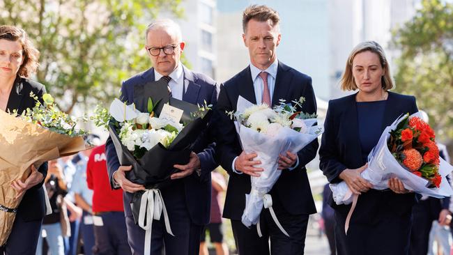 Prime Minister Anthony Albanese and NSW Premier Chris Minns joined by local politicians (left) Wentworth MP Allegra Spender and (right) Coogee MP Marjorie O’Neill, to lay floral tributes. Picture: NCA NewsWire / David Swift