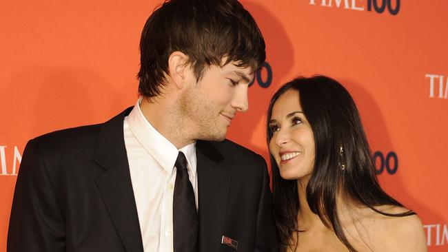 Kutcher and Moore in 2010. Picture: AFP//Timothy A. Clary