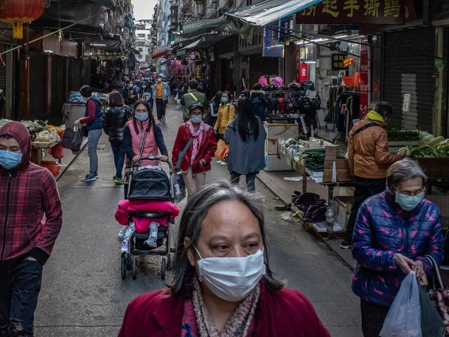 China has a single body to co-ordinate responses to viral outbreak. This week Australia had nine different levels of government giving contradictory advice. Picture: Anthony Kwan