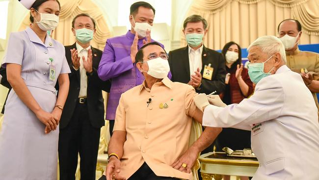 Thai Prime Minister Prayut Chan-O-Cha, centre, receives the Oxford/AstraZeneca vaccine in Bangkok on Tuesday. Picture: AFP