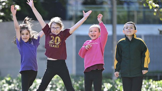 L-R Tori Paterson 7, (Windaroo State School), Summer Clatnurthy 9, (Albany Creek State School), Georgia Ruska 8, (Albany Creek State School), Austin Dolgner 8, (Coolnwynpin State School) excited during a break in rehearsals for Creative Generation at the Brisbane Convention Centre Photo: Lyndon Mechielsen