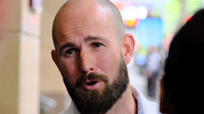 Alleged neo-nazi leader Thomas Sewell talks to members of the media outside the Melbourne Magistrates Court. Picture: NewsWire / Luis Enrique Ascui