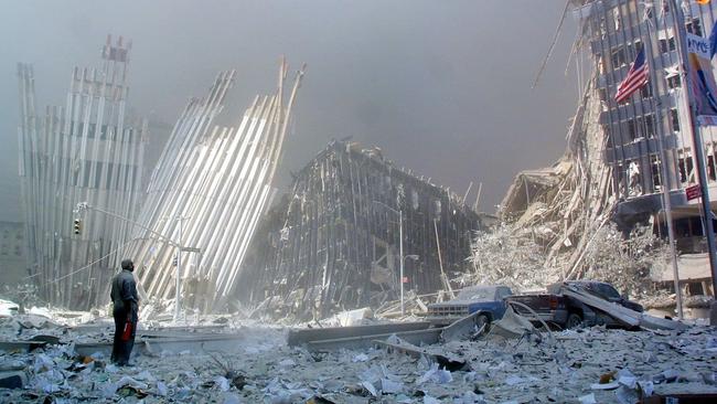 A man stands in the rubble and calls out asking if anyone needs help, after the collapse of the first World Trade Centre Tower.