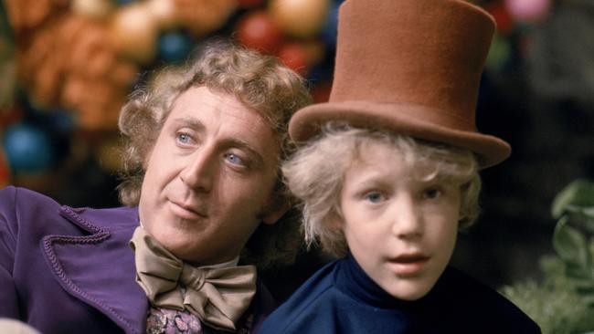 Gene Wilder as Willy Wonka and Peter Ostrum as Charlie Bucket in the 1971 film version of the story.