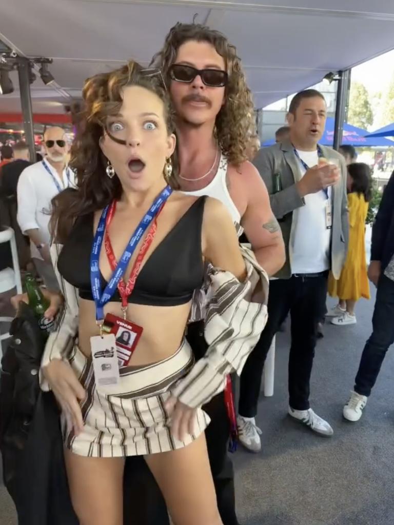 Abbie Chatfield with Peking Duk's Adam Hyde at the Melbourne Grand Prix.