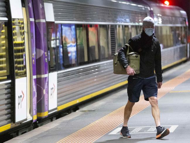 Two passengers alight the 6.37pm South Geelong express. Geelong's ghost trains. On Monday night three of the busiest rush hour trains from Southern Cross dropped off a total of 10 passengers. The trains were the 6.20pm Warrnambool (4 got off), the 6.25pm Waun Ponds (4 got off) and the 6.37pm South Geelong express (2 got off). The station was eerily quiet. Picture: Alan Barber