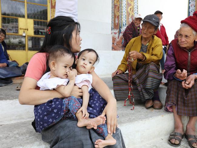 Nima and Dawa with mum Bhumchu in Bhutan last year, before they were flown to Australia to have lifesaving surgery. Picture: Alex Coppel