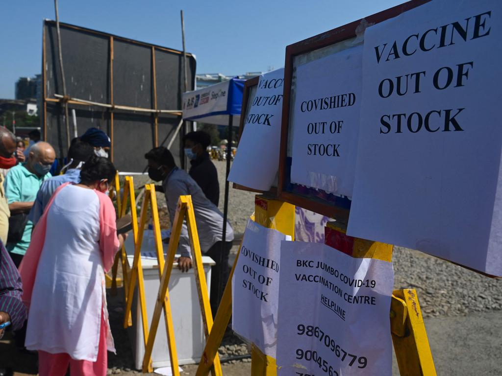 People gather around a help desk after Covishield, AstraZeneca-Oxford's COVID-19 coronavirus vaccine, went out of stock at a vaccination centre in Mumbai on April 20. Picture: Indranil Mukherjee