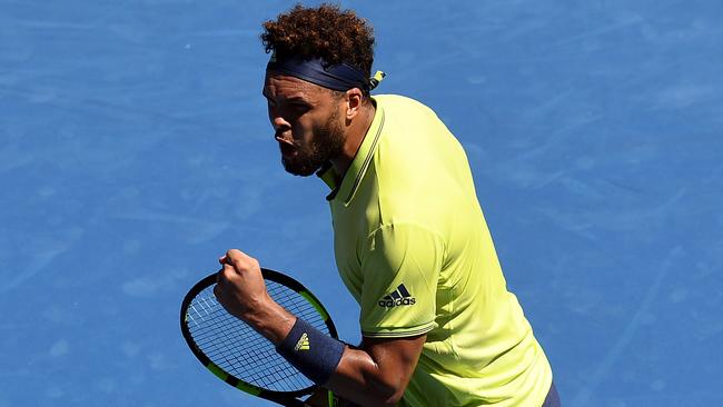 Jo-Wilfried Tsonga gets pumped up after winning the fourth set against Denis Shapovalov. Picture: AAP