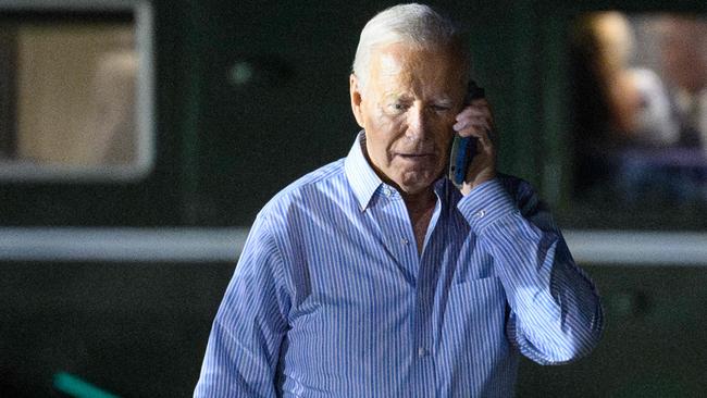 US President Joe Biden speaks on the phone before departing to the Camp David presidential retreat where he was expected to spend the rest of the weekend. Picture: AFP