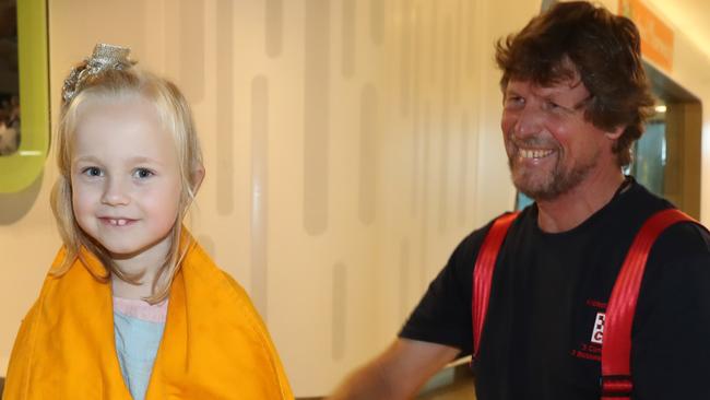 Good Friday Appeal face for 2020 Quinnie with one of her new CFA friends, Andrew Smith. Picture: Alex Coppel